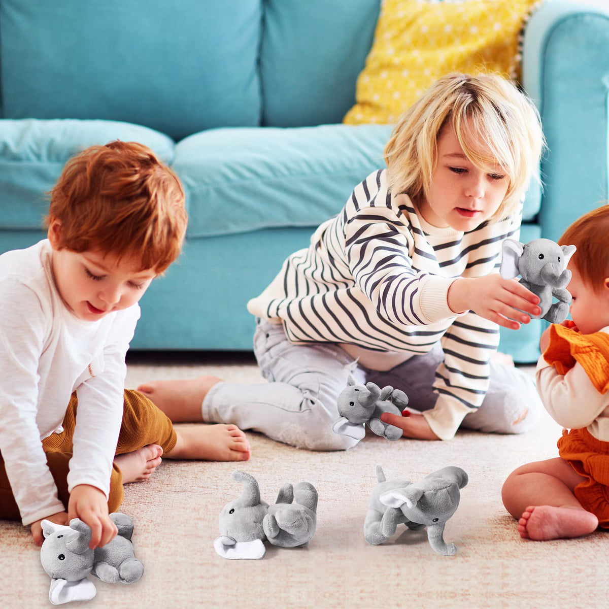 Kids sharing and cuddling Jenaai elephants during playtime