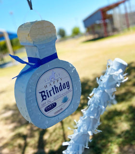 Jergrim Piñata Tequila bottle moments with confetti ready to shower celebration.