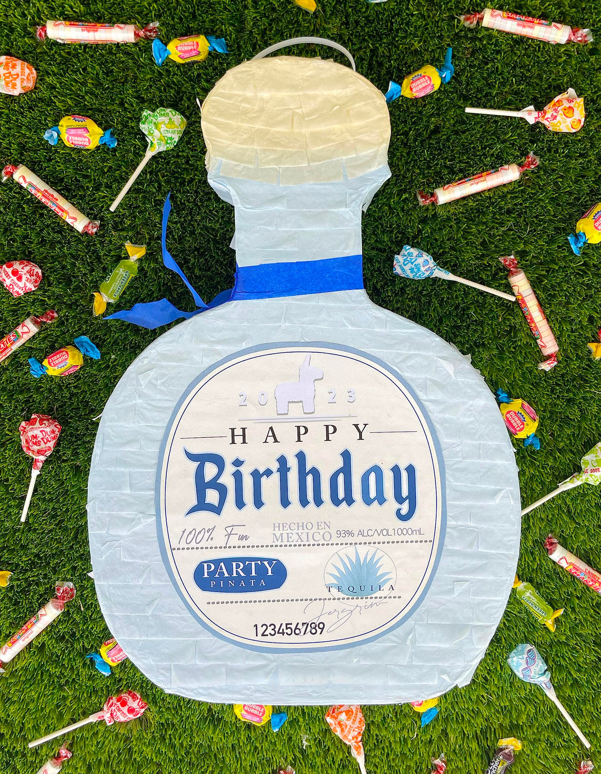 Jergrim Piñata Tequila bottle close-up, bright tissue paper and craftsmanship.