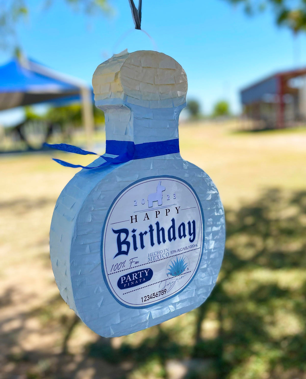 Jergrim Piñata Tequila bottle side view, showcasing durable recycled cardboard.