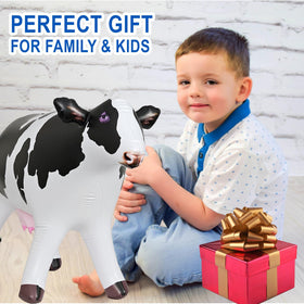 Jet Creations cow inflatable in outdoor setup enhances birthday celebration ambiance.