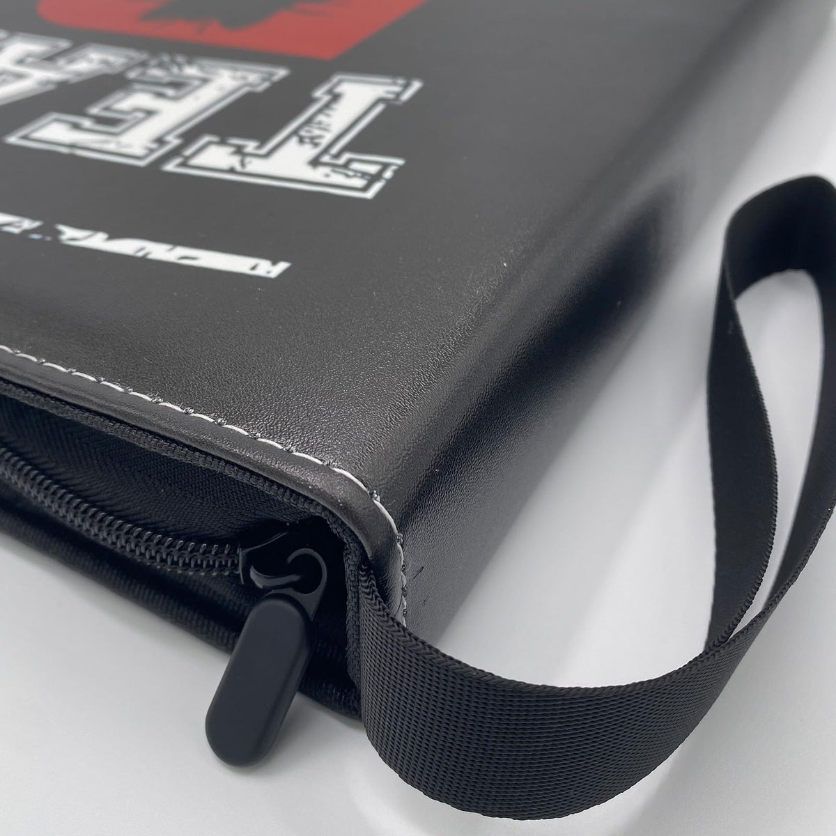 JHUFD binder with secure zipper closure protects cards during transport.
