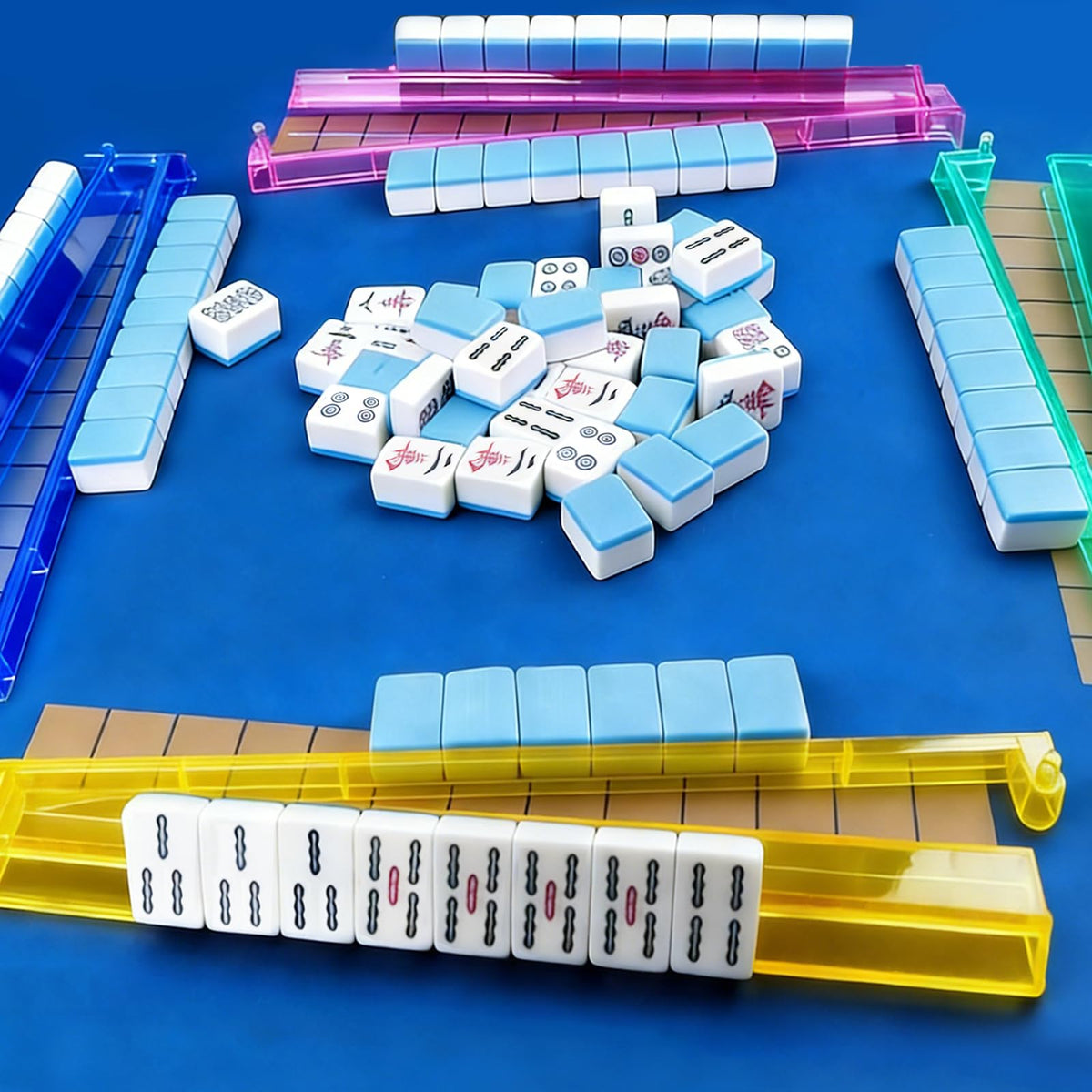 Jibrelxion mahjong rack on table with tiles for easy access during games.