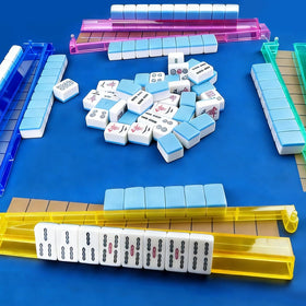 Jibrelxion mahjong rack on table with tiles for easy access during games.