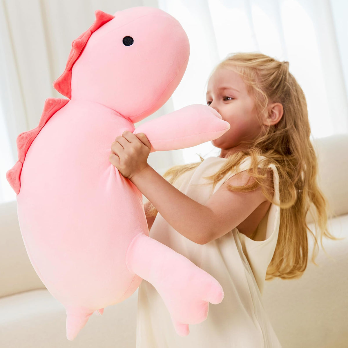 JOD dinosaur plush with bead-filled belly supports calming hugs.
