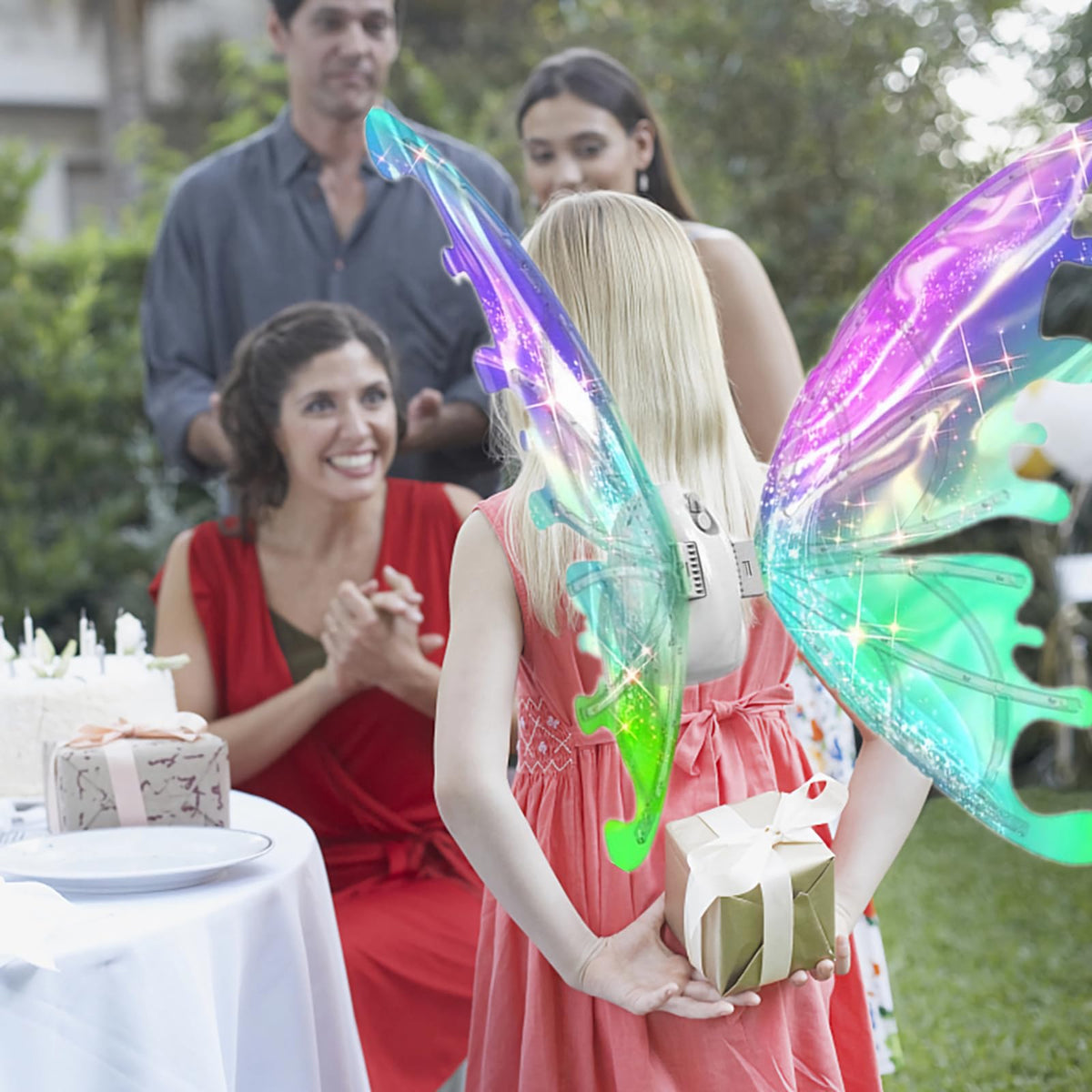 Johehe glowing wings worn by a girl for a fairy costume at a party
