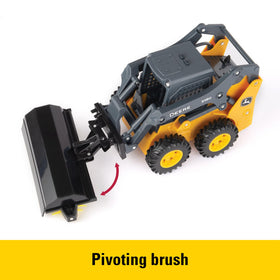 John Deere 318G with pivoting brush for sweeping pretend jobs.