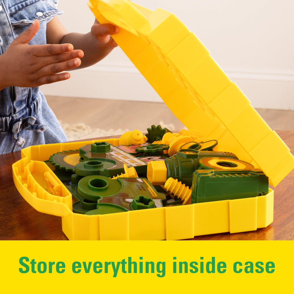 John Deere Build-A-Buddy board tractor-build scene encourages fine motor skills.