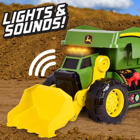 John Deere Dig Rig front loader showcasing lifting action for treasure scooping.