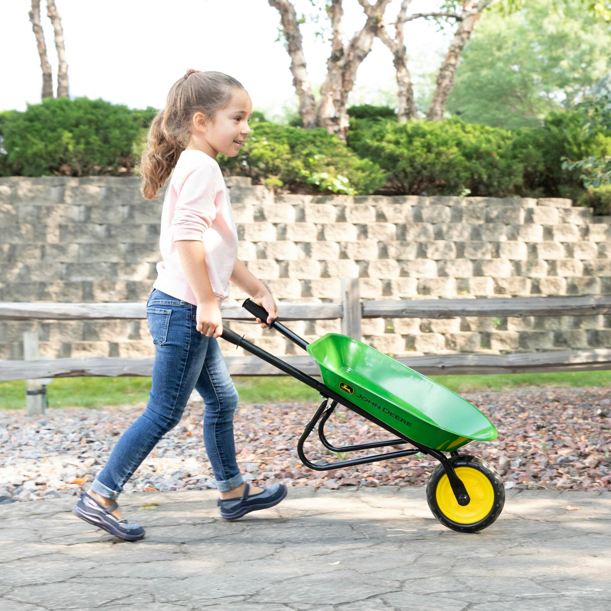 John Deere licensed wheelbarrow in authentic colors supports imaginative outdoor chores.