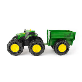 John Deere Monster Treads wagon hitched to tractor enables farm-haul pretend play.
