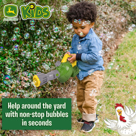 John Deere bubble blower used outdoors in a sunny yard for active play.