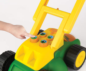 John Deere Tomy lawn mower side view with compact toddler-friendly design.