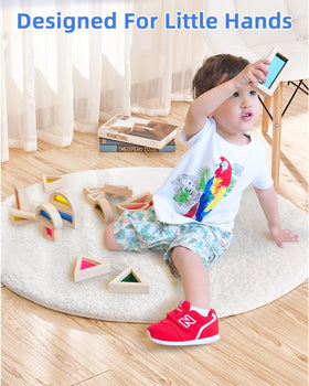 Child stacking blocks during independent play, exploring shapes and balance.