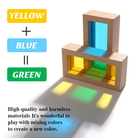 A child stacking JOLKID blocks on a light table to explore color and shadow.