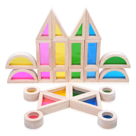 JOLKID wooden blocks with rainbow windows creating a colorful light display.