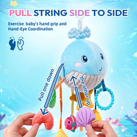 Jollybaby Ocean Whale toy attached to crib, promoting gentle play and reach.
