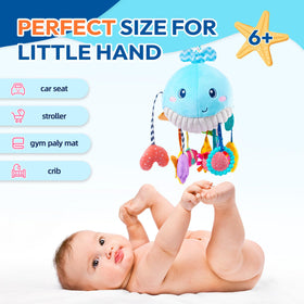 Jollybaby Ocean Whale toy pull-cord action fostering cause-and-effect awareness.