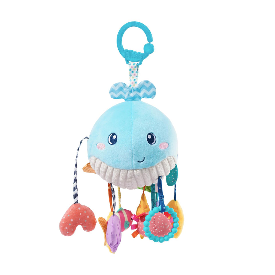 Jollybaby Ocean Whale toy hangs from a stroller, encouraging grasp and sensory exploration.