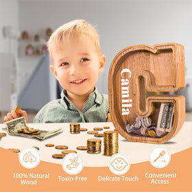 JOOMLAFLY wooden letter piggy bank with acrylic panel showing savings progress clearly.