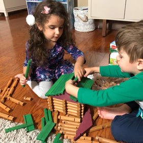 Joqutoys wooden logs cabin pieces to build barns, houses, and habitats.