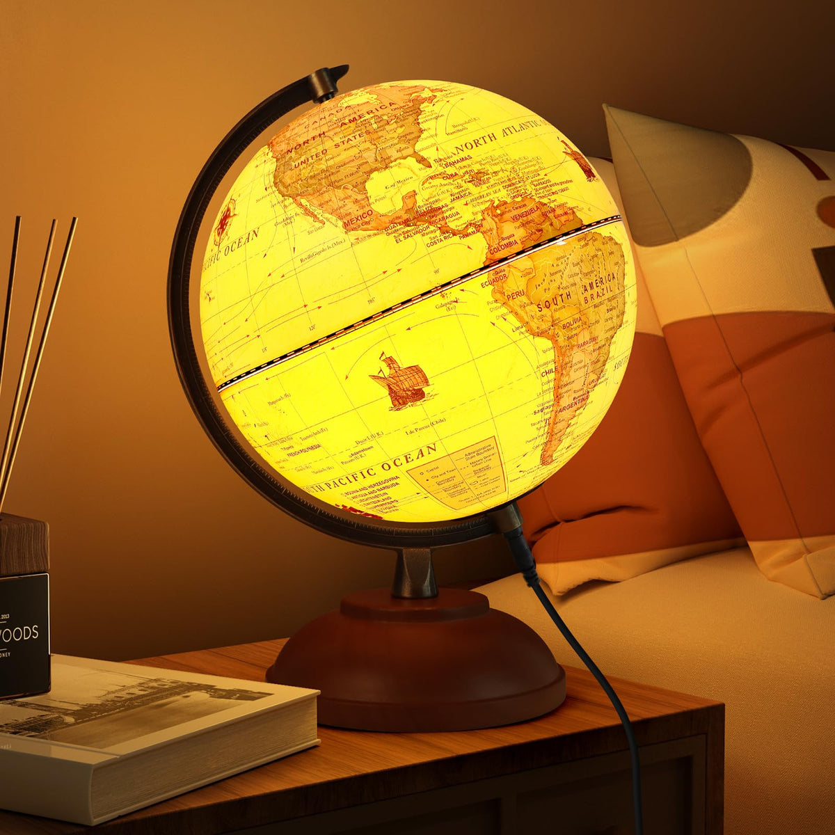 JOWHOL illuminated globe with wood stand on desk, ideal for study and ambient lighting.