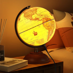JOWHOL illuminated globe with wood stand on desk, ideal for study and ambient lighting.