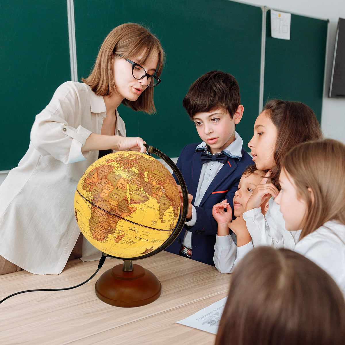 JOWHOL world globe on study desk blends classroom decor with illumination.