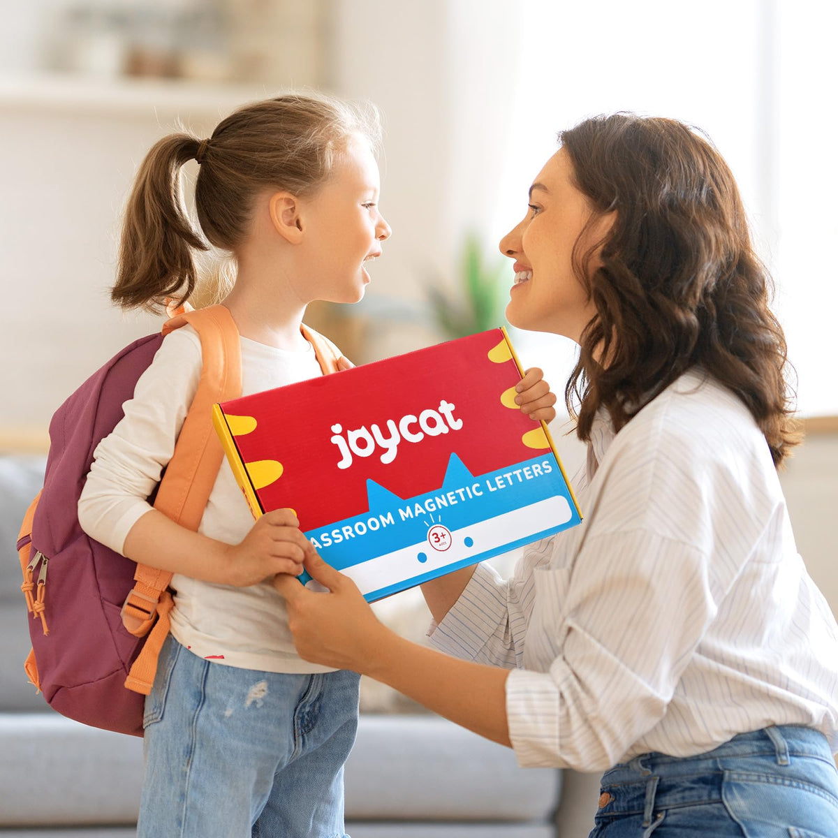 JoyCat teaching scene shows kids collaborating with the kit for learning.