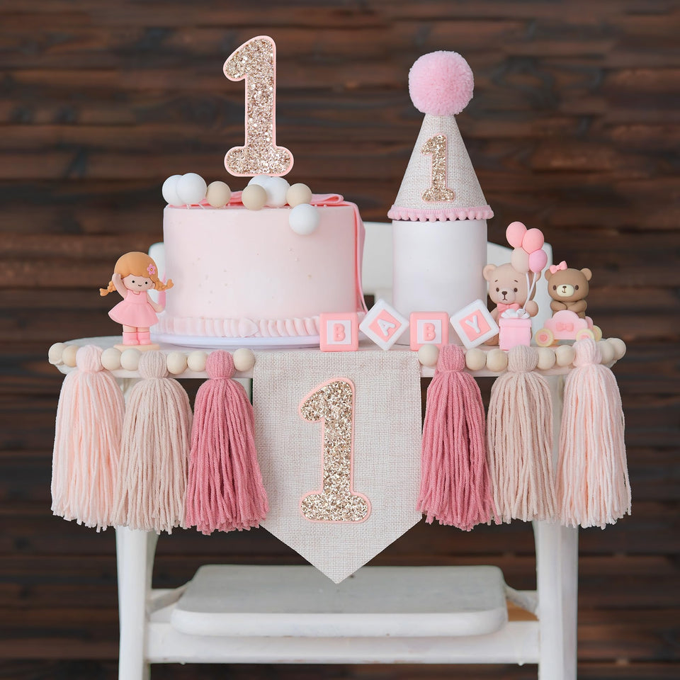 JUIIZAY pink first birthday banner over a high chair for sweet photos.
