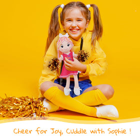 June Garden Sophie cheerleader outfit with pink outfit and gold pom-poms, inspire pretend play