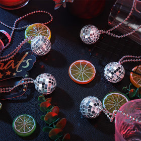 Junkin 48-pack disco ball necklaces for versatile party decor and favors.