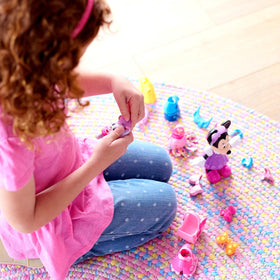 Cream Puff pet figure with four coordinating outfits for double pretend play.