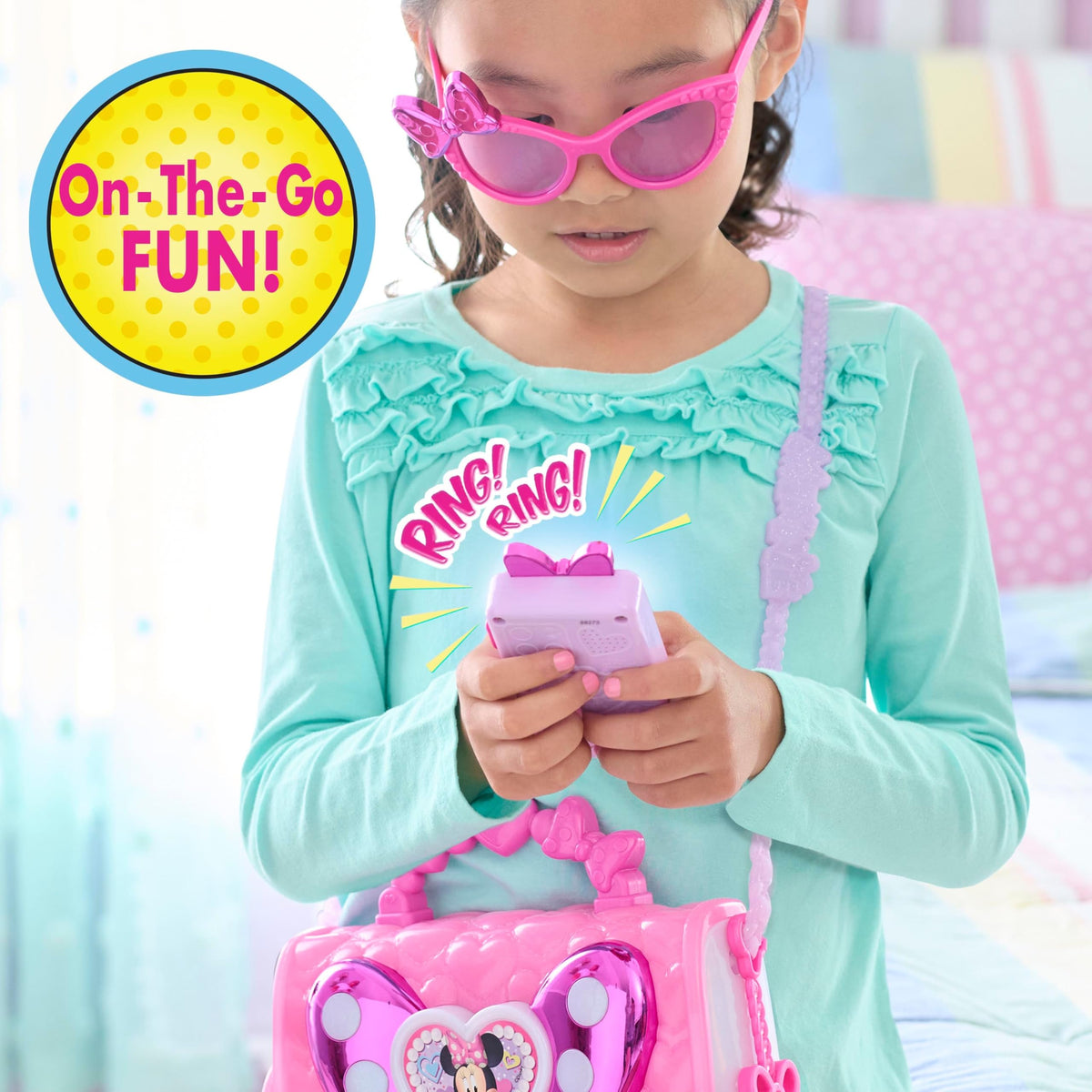 Just Play Disney Minnie Bowfabulous bag lights-and-sounds cell phone demonstrates interactive play