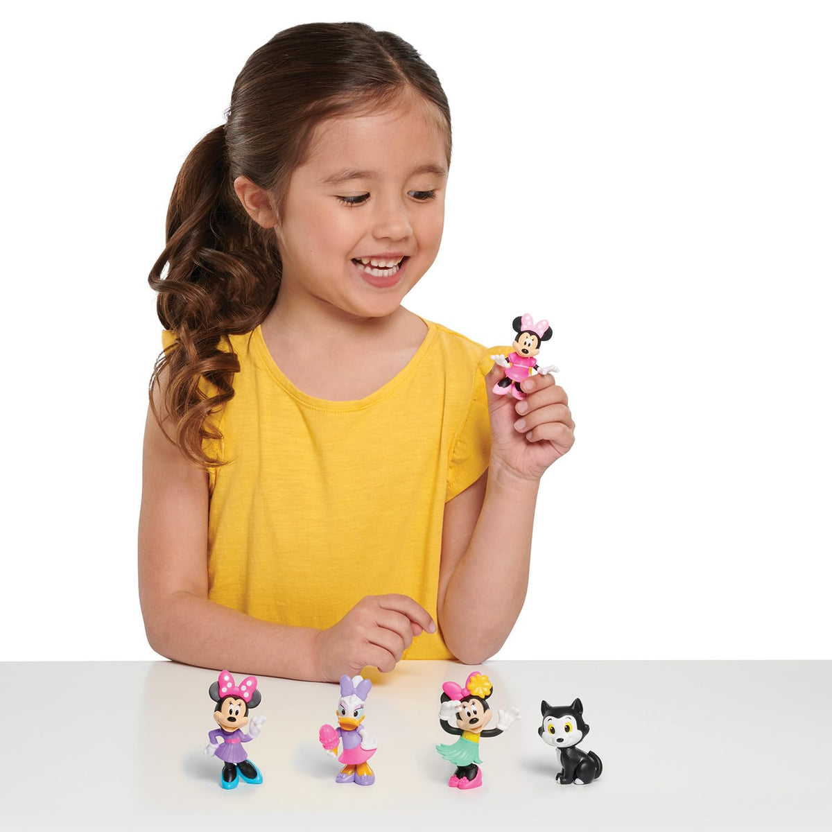 Just Play Disney Junior Minnie in purple dress mini figure supports colorful storytelling.