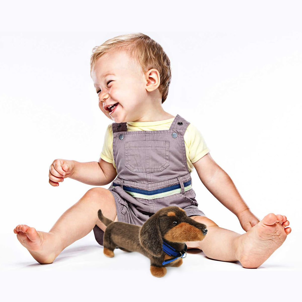 JUSTQUNSEEN dachshund plush being hugged by a child for safe play