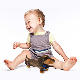 JUSTQUNSEEN dachshund plush being hugged by a child for safe play