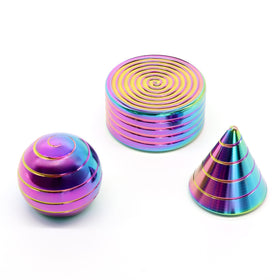KALMORA kinetic desk toy spinning spiral on a desk, focus aid and visual centerpiece.
