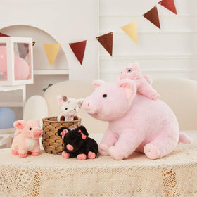 Nursery decor idea featuring Karister pig plush family.