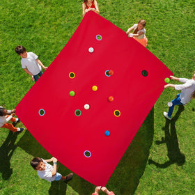 Kathfly red hole tarp setup promotes teamwork during outdoor games.