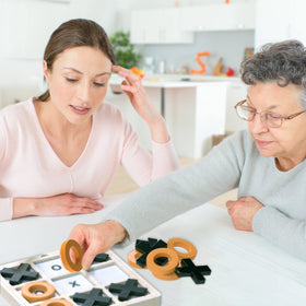Keeping Busy family game night with dementia-friendly challenges.