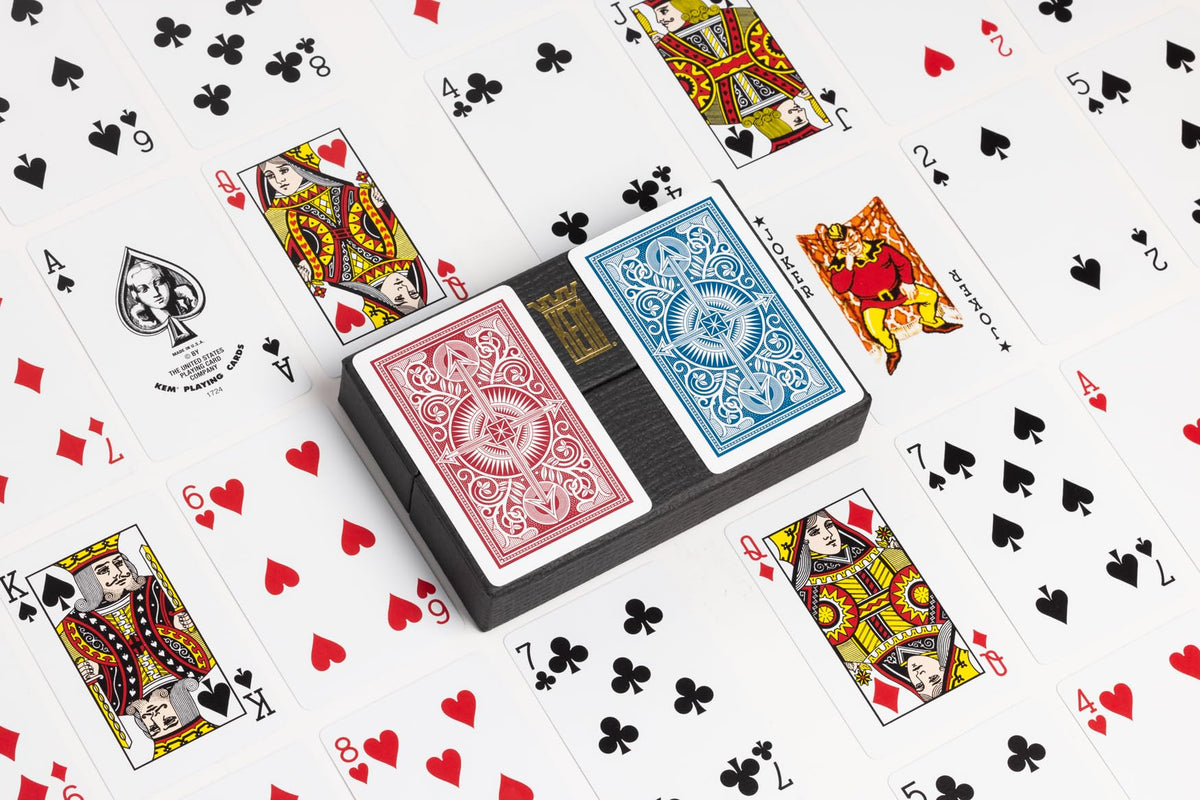 KEM Arrow bridge-size cards with comfortable grip for extended play.