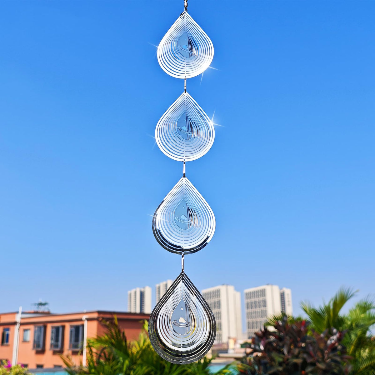 Kexsscai wind spinner in a sunny backyard scene deters birds while enhancing ambiance.