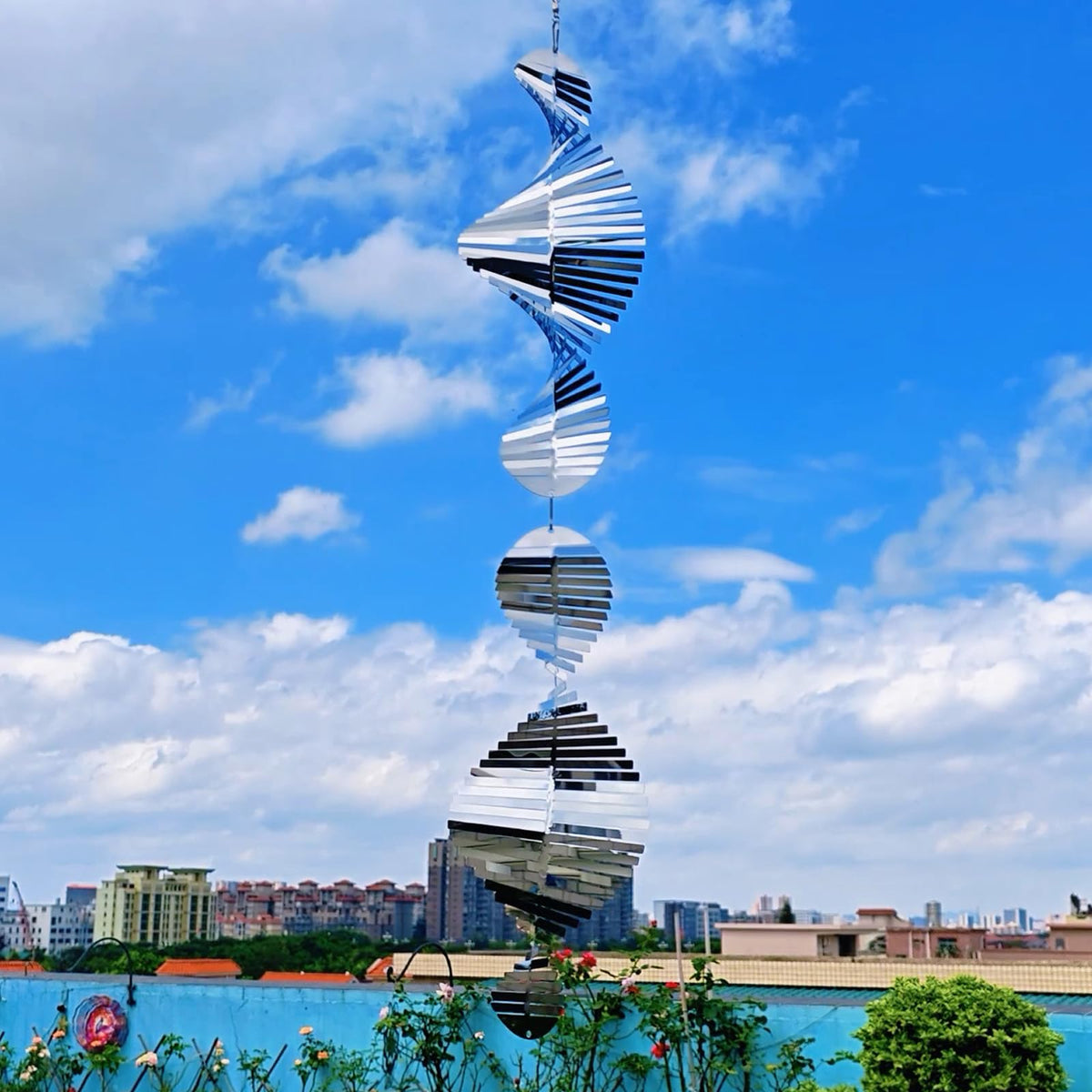 Kexsscai 12 inch wind spinner spins in breeze to create shimmering light patterns