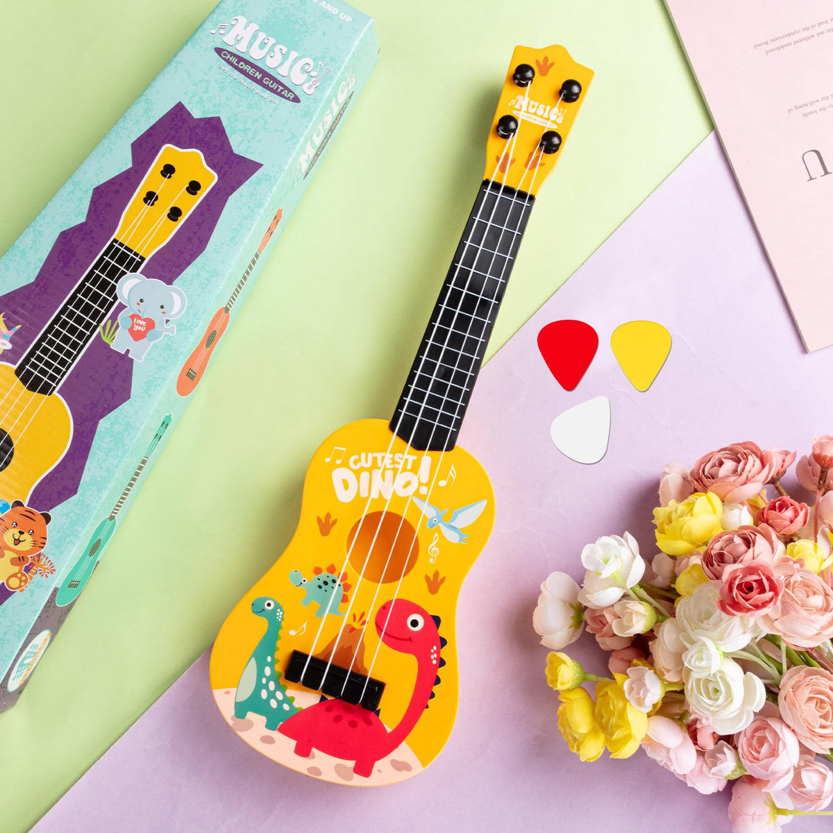 KFPPLXQ mini guitar dinosaur packaging, gift-ready for birthdays or holidays.