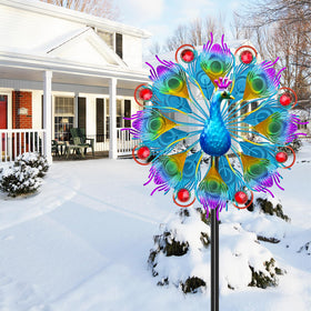 KHayRovies kinetic peacock sculpture spins gracefully in a breeze