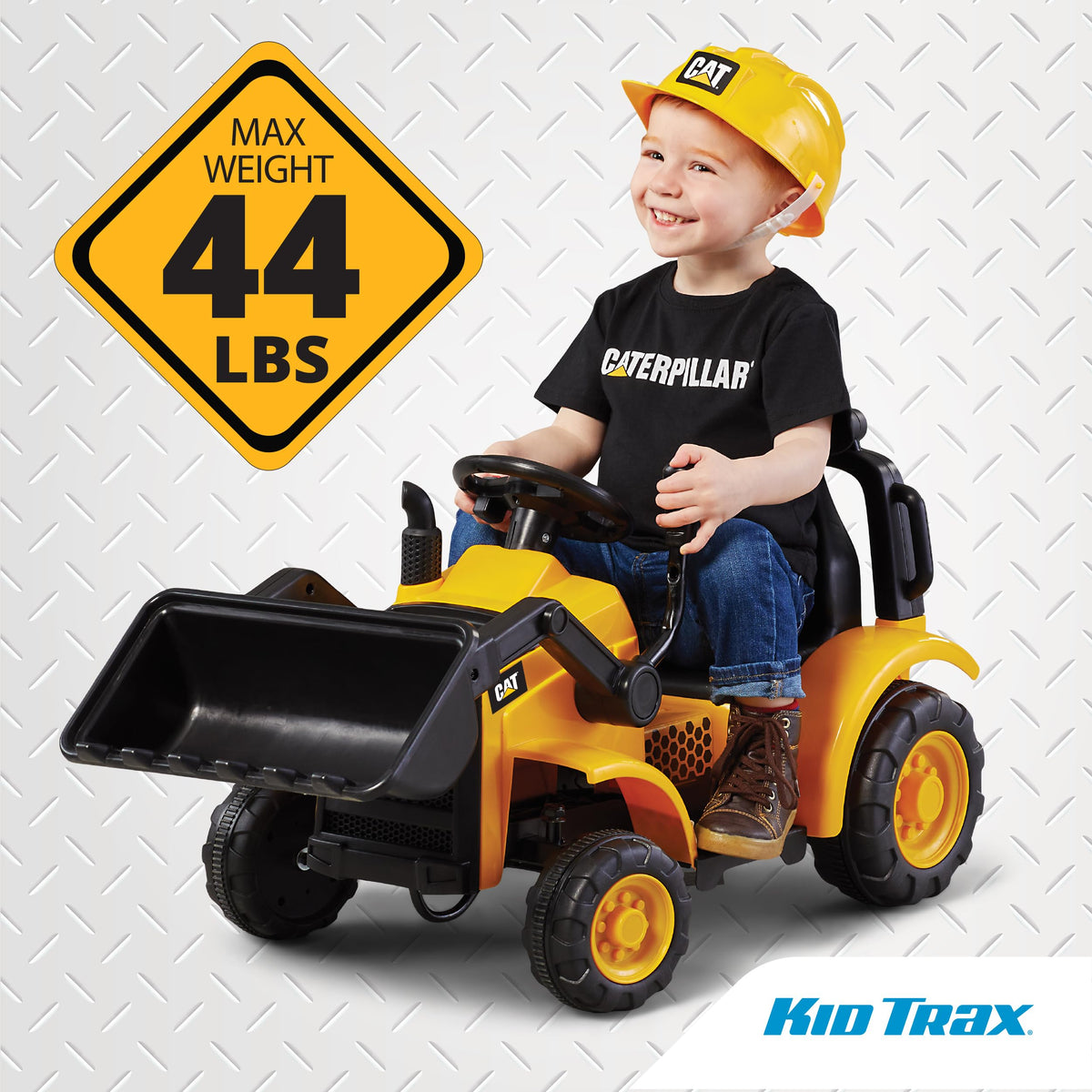 Kid Trax Frontloader on driveway demonstrates kid-friendly outdoor fun.