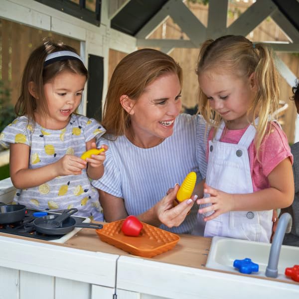Inside the KidKraft Lantana Lane playhouse kitchen area for imaginative play