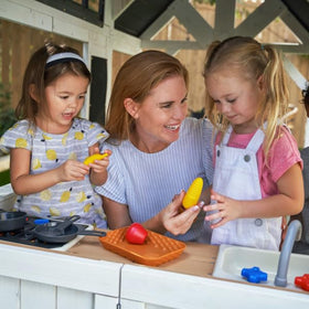 Inside the KidKraft Lantana Lane playhouse kitchen area for imaginative play