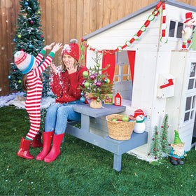 KidKraft chalkboard on outdoor playhouse for drawings outdoors.
